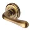 Heritage Brass Door Handle Lever Latch on Round Rose Charlbury Design Antique Brass finish