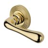 Heritage Brass Door Handle Lever Latch on Round Rose Charlbury Reeded Design Polished Brass finish
UK Registered Design Number 6226298