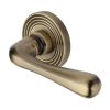 Heritage Brass Door Handle Lever Latch on Round Rose Charlbury Reeded Design Antique Brass finish
UK Registered Design Number 6226298