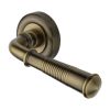 Heritage Brass Door Handle Lever on Rose Reeded Colonial Design Antique Brass Finish