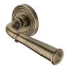 Heritage Brass Door Handle Lever Latch on Round Rose Bridgetown Reeded Design Antique Brass finish
UK Registered Design Number 6226297