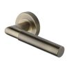 Heritage Brass Door Handle Lever Latch on Round Rose Bauhaus Mitre Reeded Design Antique Brass finish