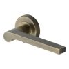 Heritage Brass Door Handle Lever Latch on Round Rose Metro Mid Century Design Antique Brass finish