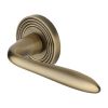 Heritage Brass Door Handle Lever Latch on Round Rose Sutton Reeded Design Antique Brass finish
UK Registered Design Number 6204750